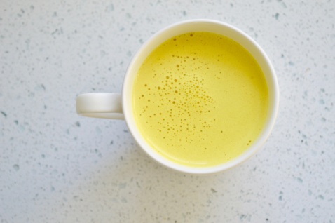 Turmeric latte in a white cup