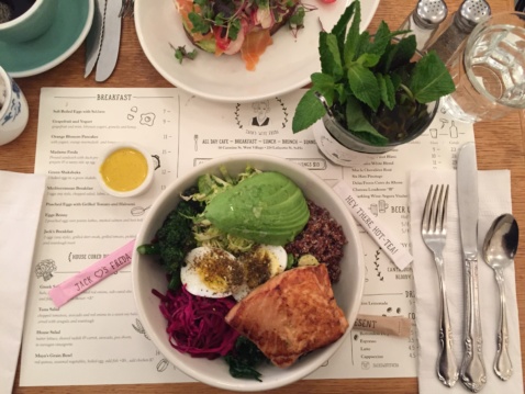 A Buddha bowl with quinoa, salmon, greens and a hard boiled egg