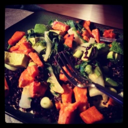 A Gandhi Bowl prepared with rice, sweet potatoes and greens.