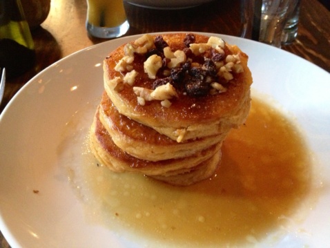 Pumpkin Pancakes with whipped maple butter, syrup, raisins, brown sugar and walnuts