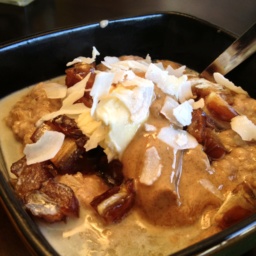 Gluten-free banana bread oatmeal with dates in a black square bowl