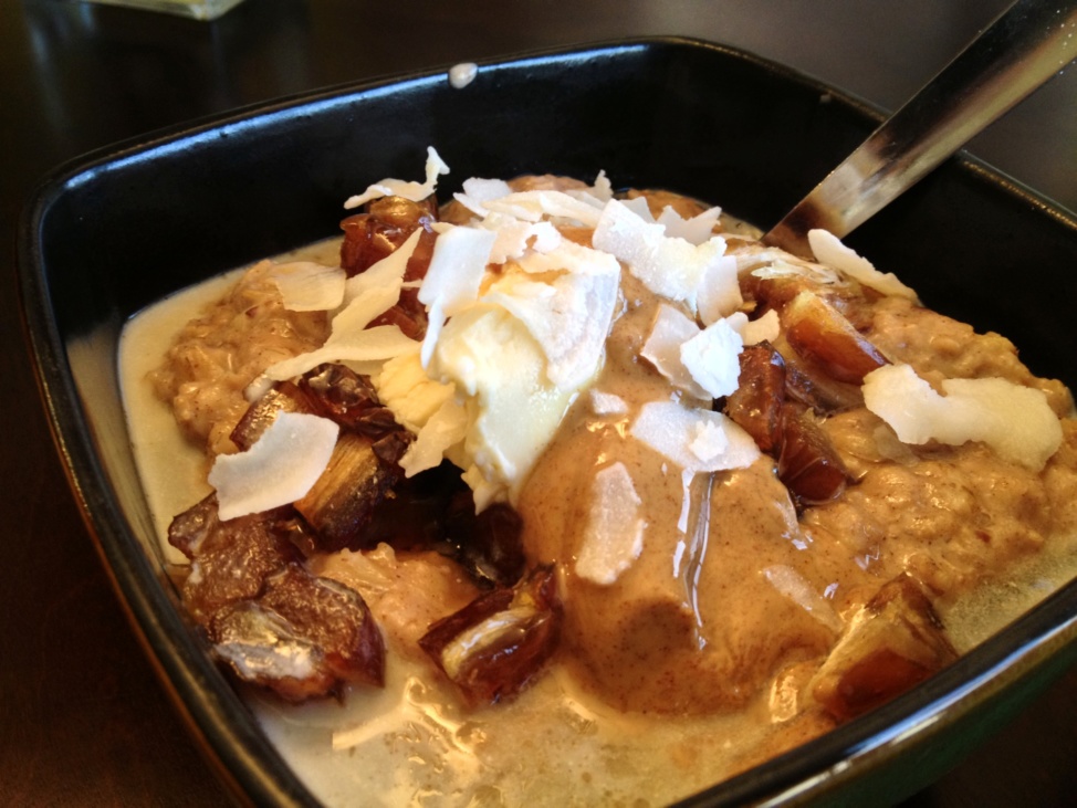 Gluten-free banana bread oatmeal with dates in a black square bowl