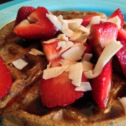 Vegan, gluten-free banana waffles topped with strawberries