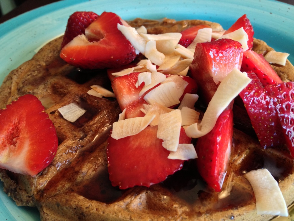 Vegan, gluten-free banana waffles topped with strawberries