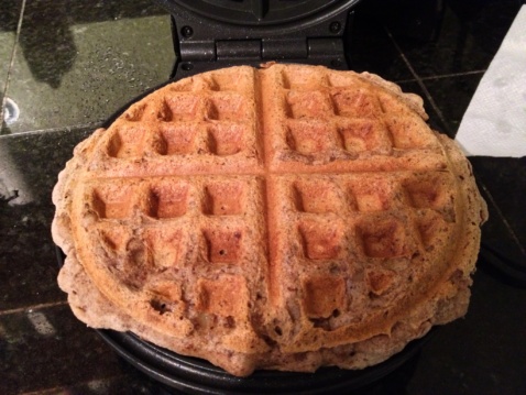 A baked waffle on the waffle iron