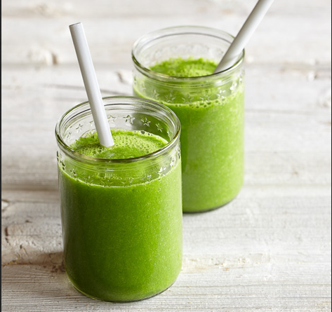 Two glasses with green smoothie