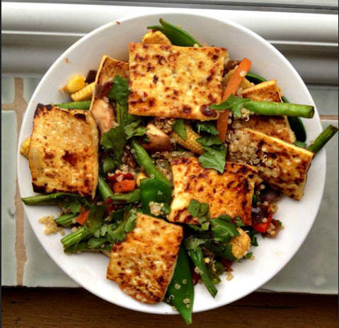 Grilled tofu and veggies in a white bowl