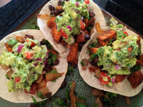 Three Tortillas with roasted sweet potatoes, black beans, and guacamole