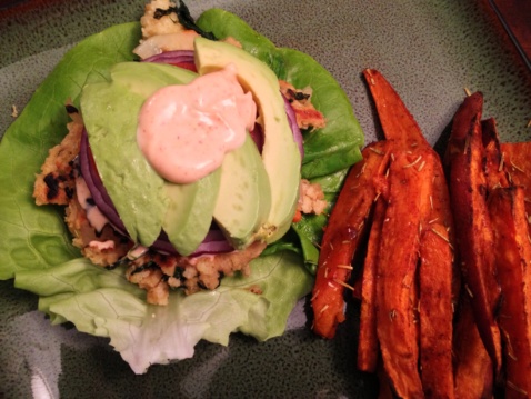 A burger made only of vegetables and sweet potato fries on a plate