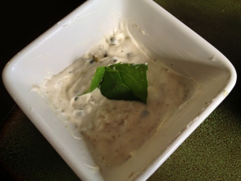A white ramekin with aioli