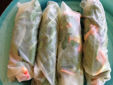 Four fresh rolls on a plate