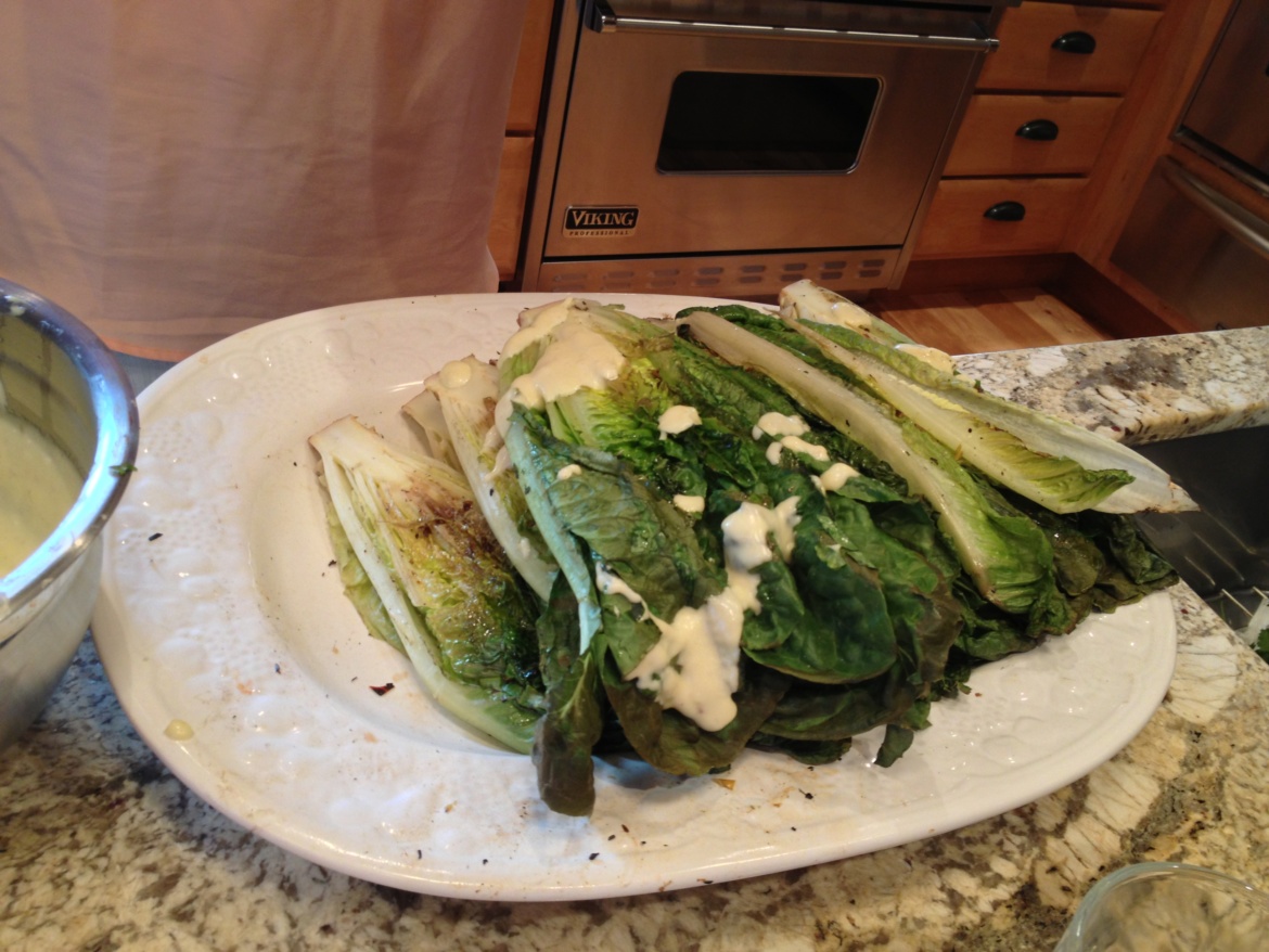 Grilled romaine on a white platter