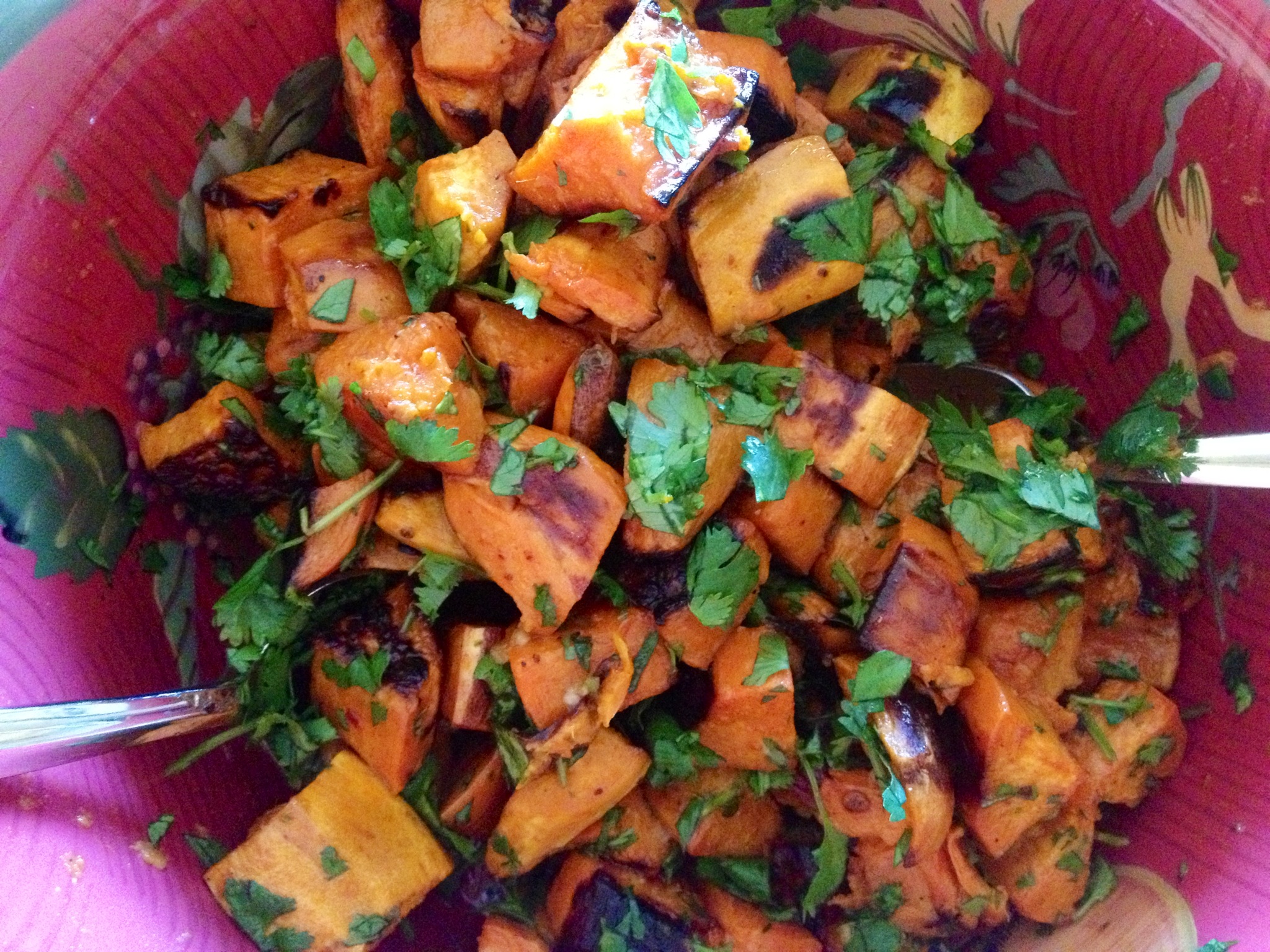 Roasted chopped sweet potatoes with cilantro