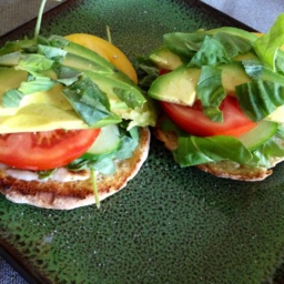 A summer sandwich with whole-grain bread, tomato, cucumber, avocado, and Vegenaise