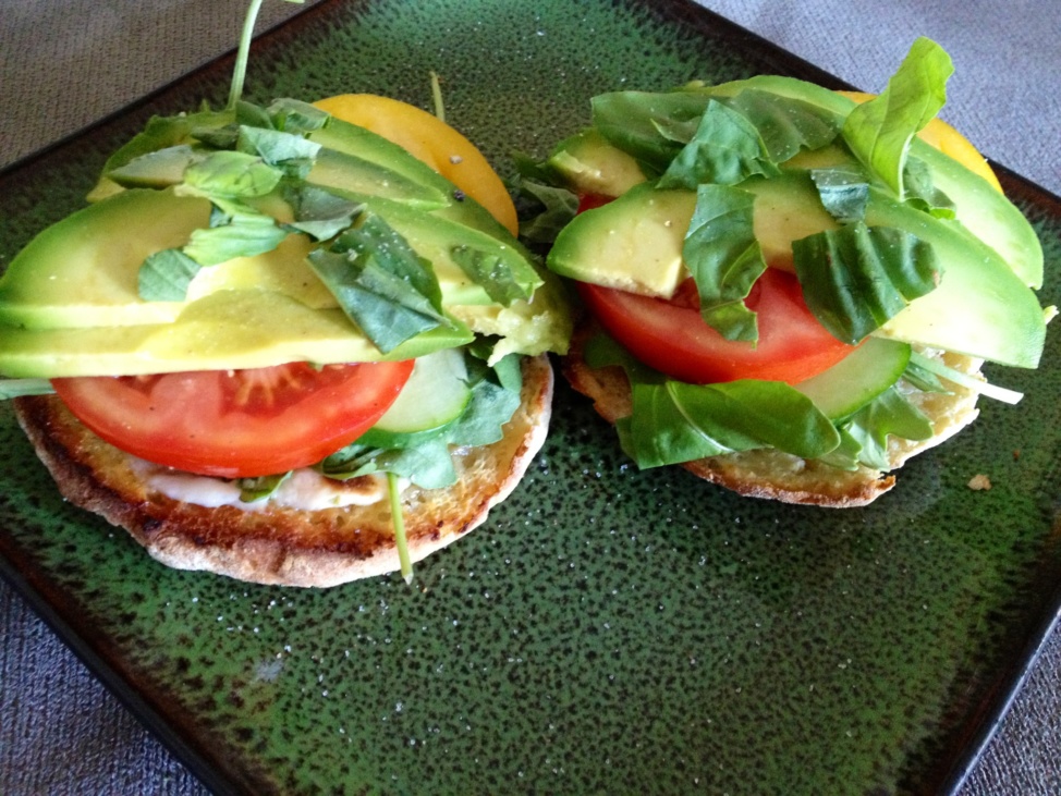 A summer sandwich with whole-grain bread, tomato, cucumber, avocado, and Vegenaise