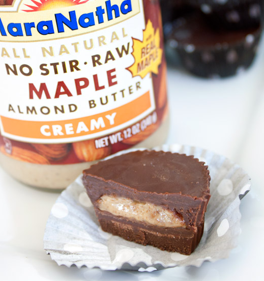 A jar of almond butter and a vegan almond butter cup