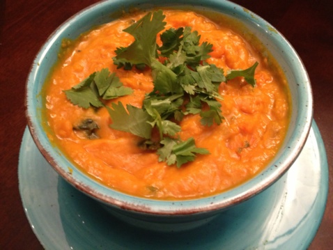 Thai-style Pumpkin Curry with cilantro on top in a light blue bowl