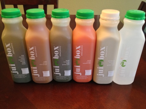 Six Juicebox labeled bottles on a table