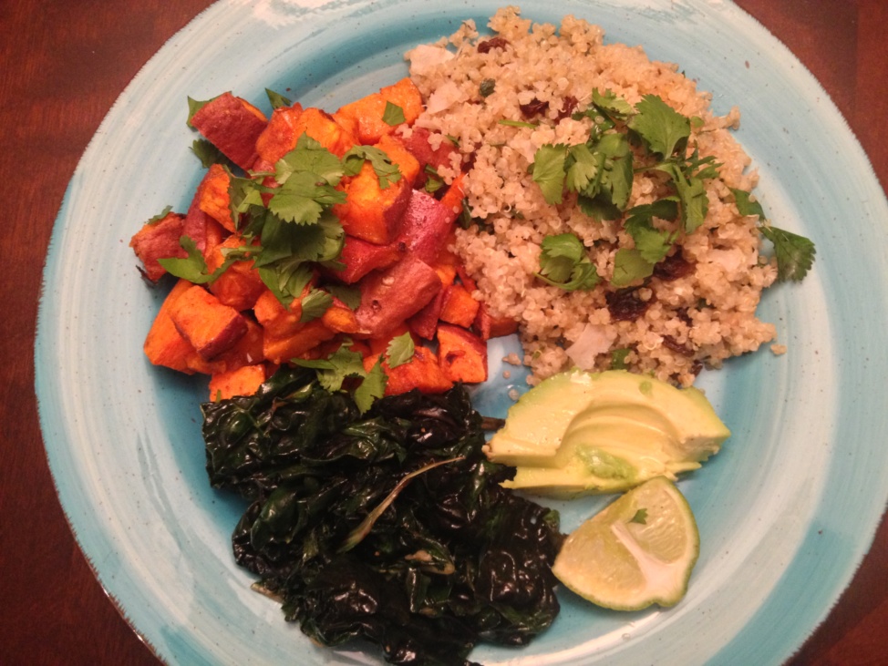 Sweet potatoes, quinoa pilaf, and greens on a light blue plate