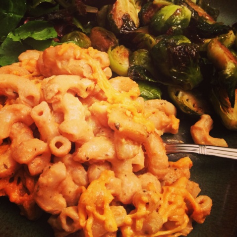 Macaroni and cheese and roasted Brussels sprouts on a plate