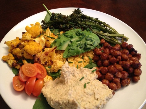Buddha bowl with chickpeas, roasted veggies, ranch hummus and greens