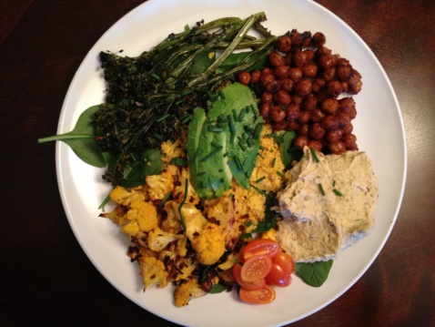 Buddha bowl with chickpeas, roasted veggies, ranch hummus and greens
