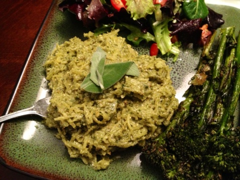Spaghetti squash with pesto and greens on a plate