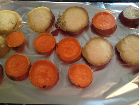 Sliced sweet potatoes on tin foil
