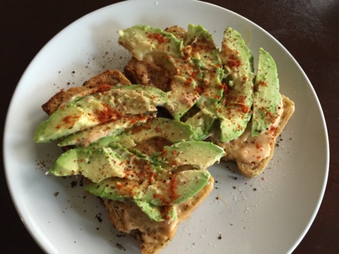 Avocado toast seasoned with salt, pepper, and paprika