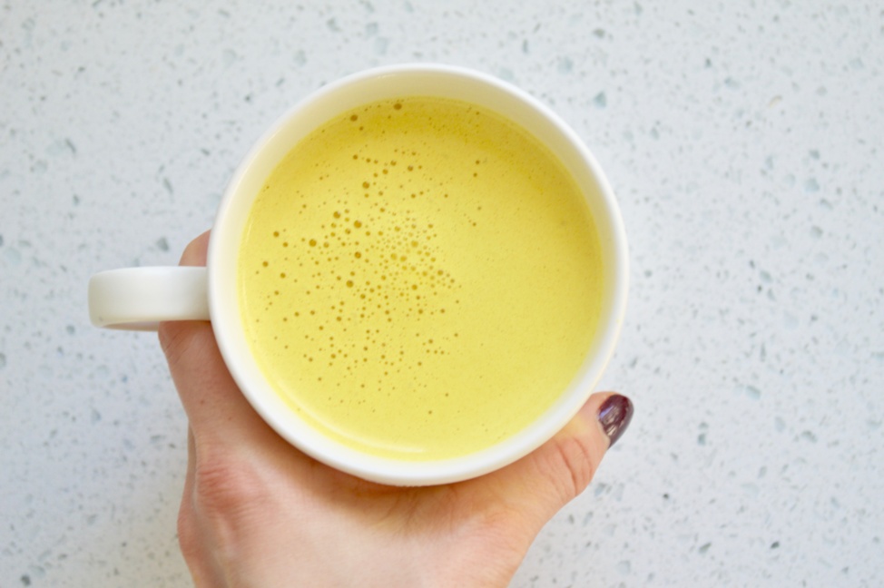 Turmeric latte in a white cup