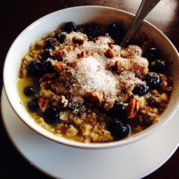 Vegan coconut blueberry oats with almond butter, maple syrup and chia seeds