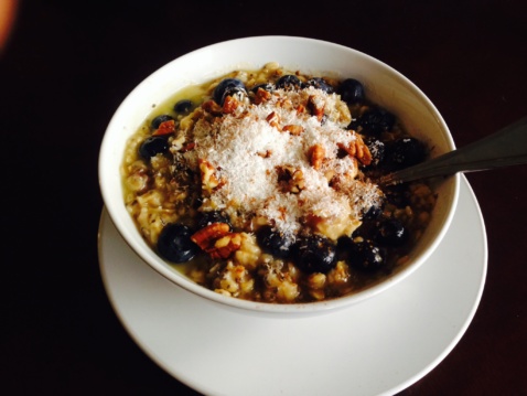 Vegan coconut blueberry oats with almond butter, maple syrup and chia seeds