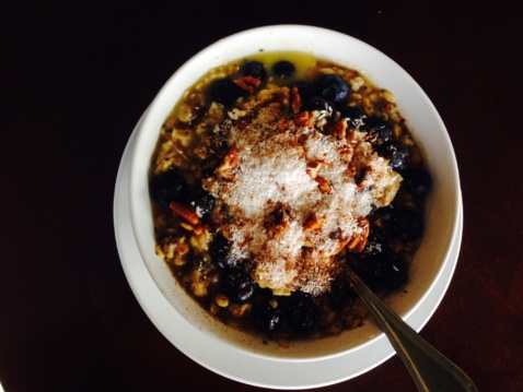 Coconut blueberry oats with almond butter, maple syrup and chia seeds