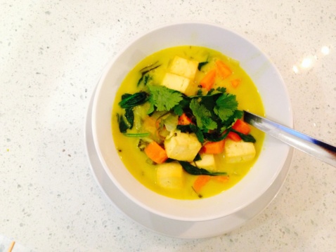Coconut curry with tofu, carrots, and greens