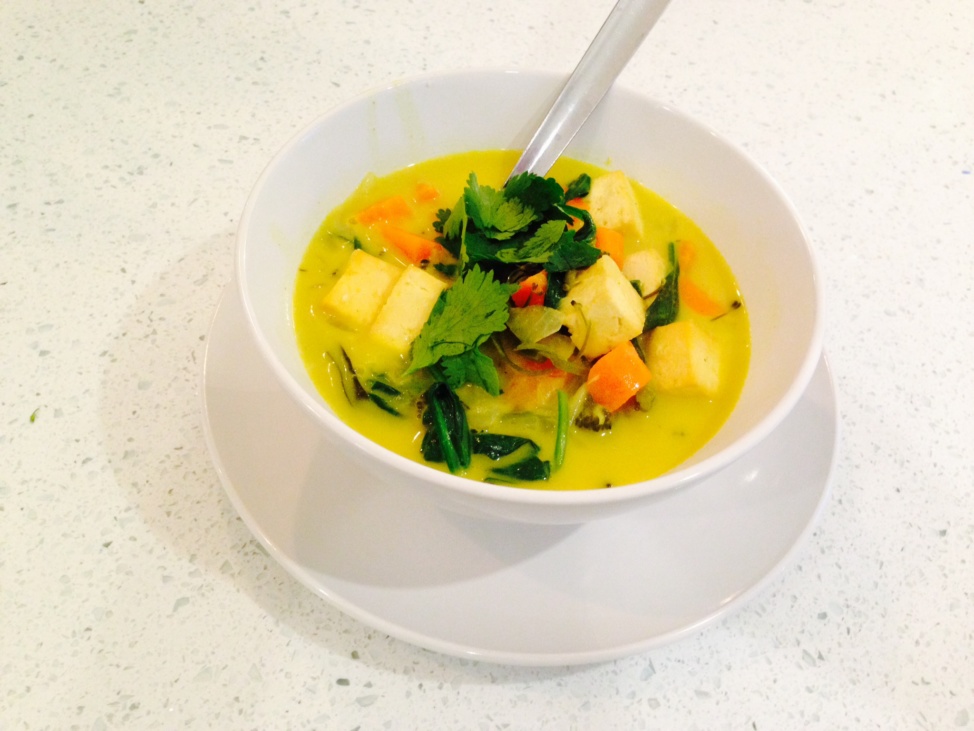 Coconut curry with tofu, carrots, broccolini and greens