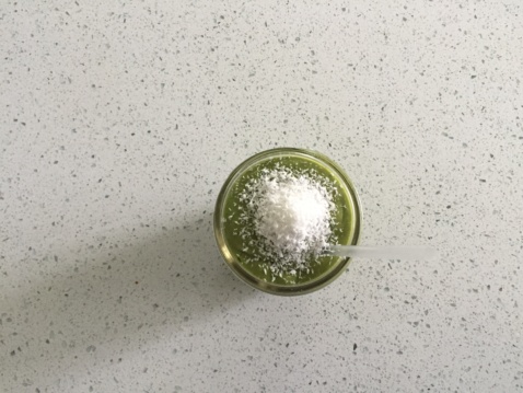 The green superfood smoothie on a kitchen counter