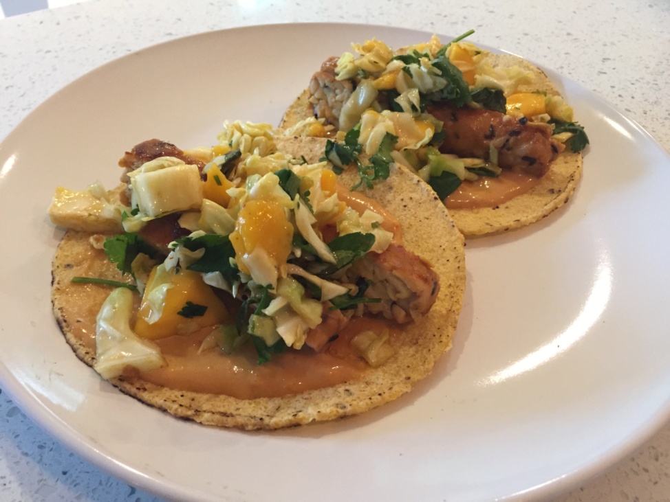 Two grilled tempeh tacos on a plate