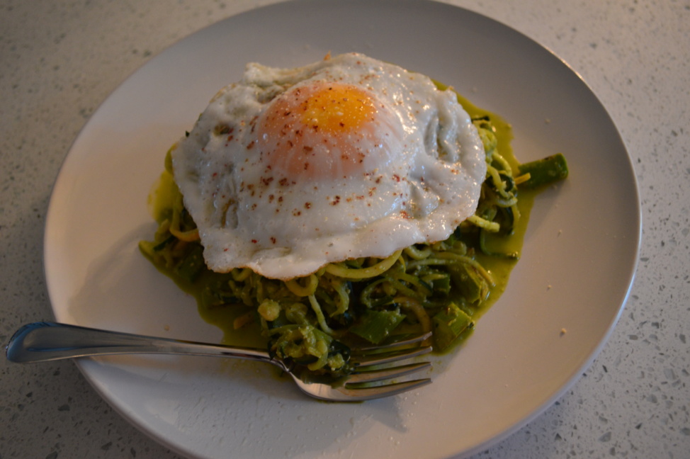 Zucchini pasta with pesto and fried egg