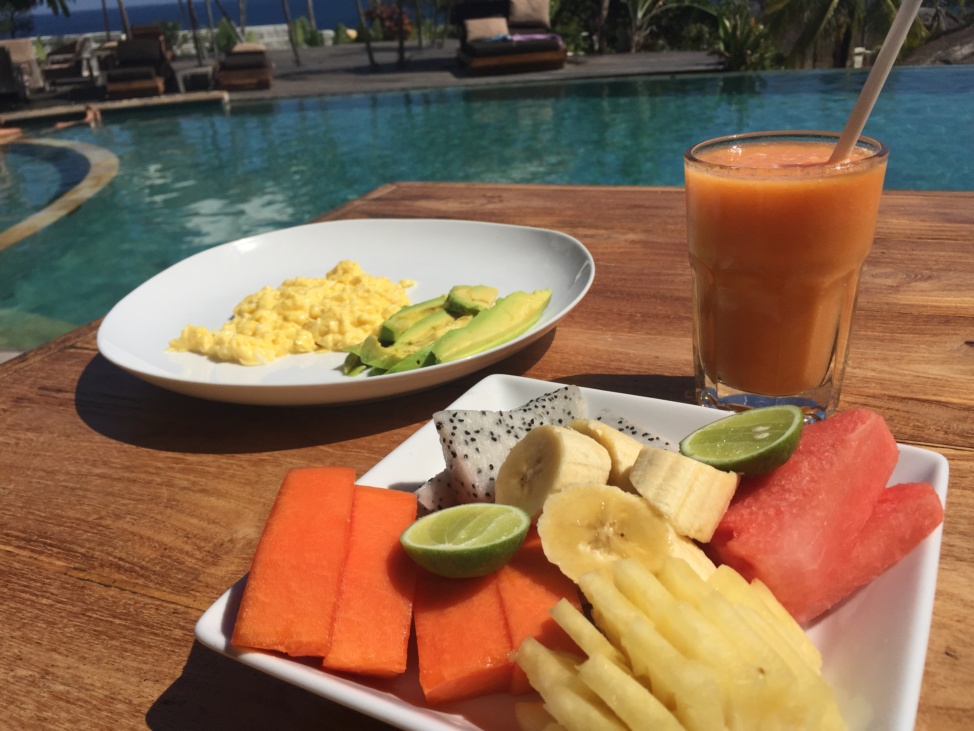 Scrambled eggs and fruits for breakfast