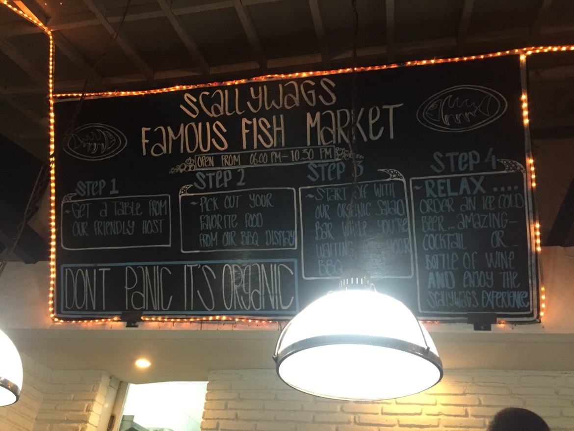 Scallywag's Seafood menu written on a chalkboad