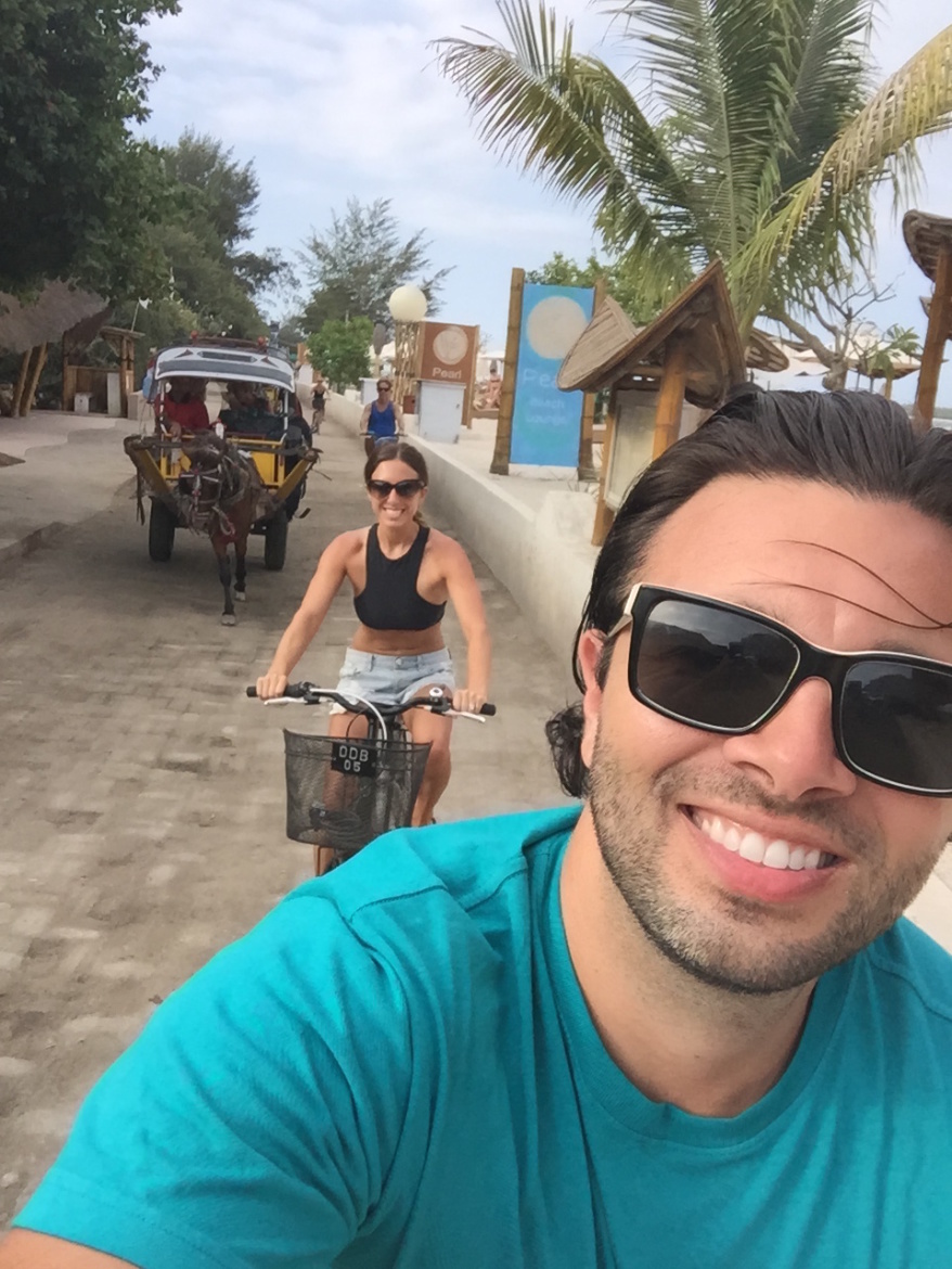 Lauren and her husband biking on Gili Island