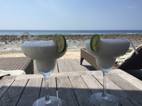 Two coconut margaritas on the beach