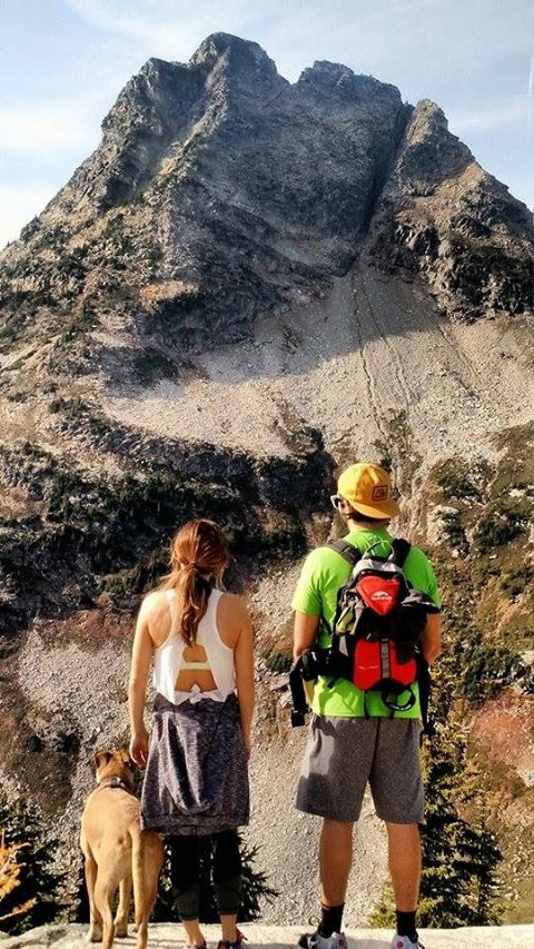 Lauren, her husband, and their dog on a hike