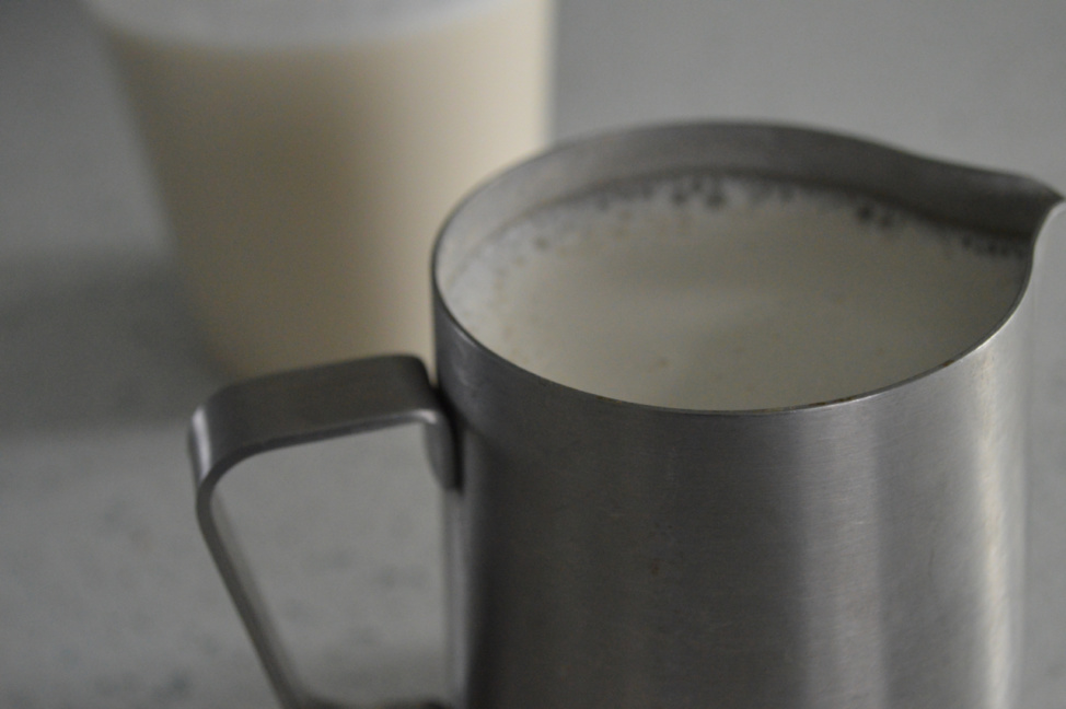 Cashew milk in a metal pitcher