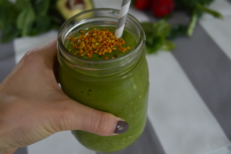 Lauren holding the Minty Shamrock Green Smoothie in a mason jar