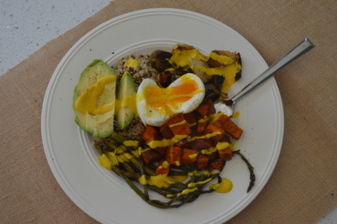 A grain bowl with quinoa, Brussels sprouts, sweet potatoes and a boiled egg