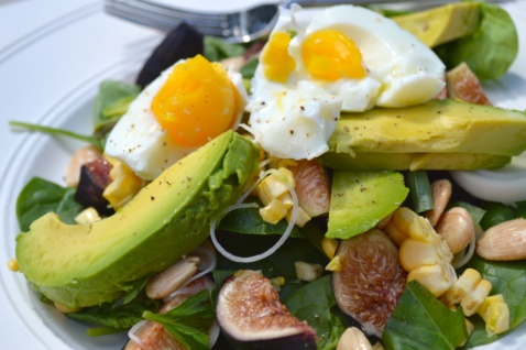 Summer salad with figs, sweet corn and sun gold tomatoes with a boiled egg