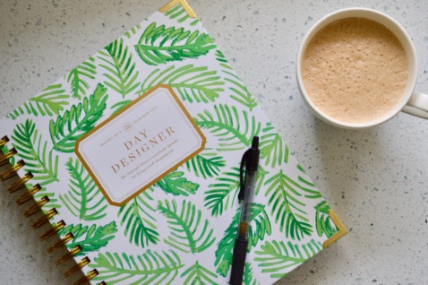 Day Designer planner and a cup of coffee