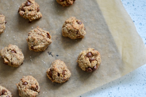 paleo salted dark chocolate chip cookie balls on parchment paper