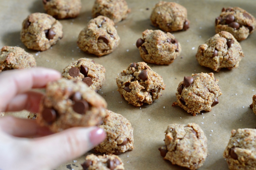Lauren holding a salted dark chocolate chip cookie